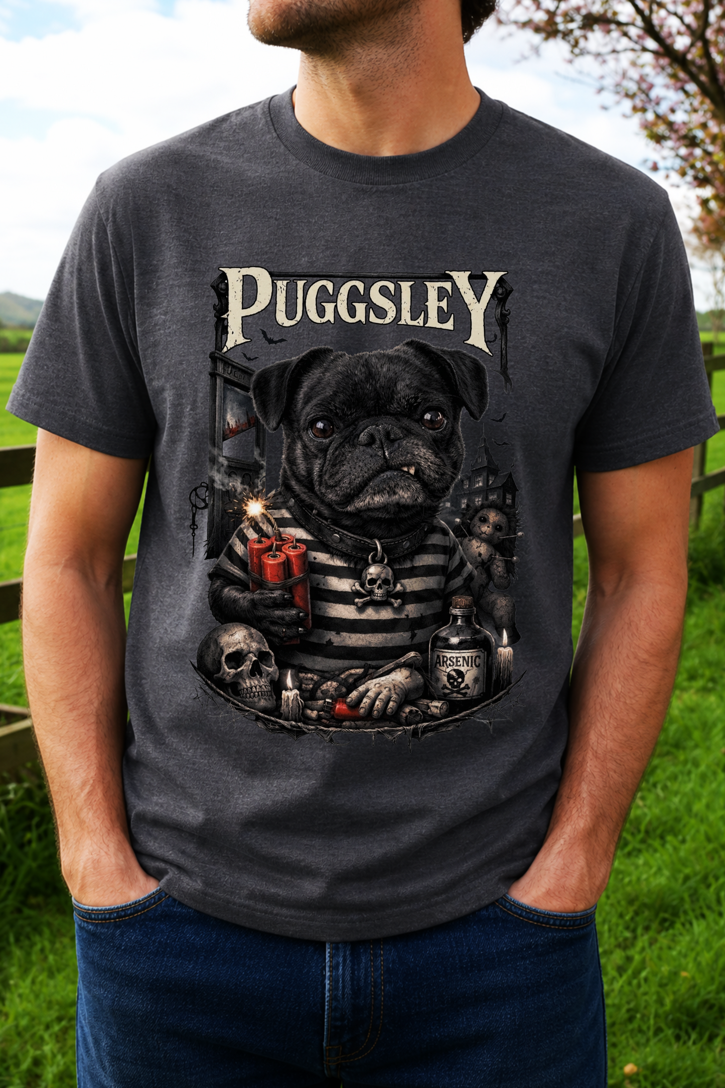A man wearing a dark gray graphic t-shirt featuring a cartoon pug dressed as a skeleton with the text 'PUGGSLEY' above it.